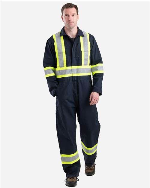 Berne Apparel Men's Safety Striped Unlined Coverall in Navy, front view on model