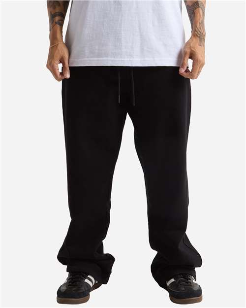 Shaka Wear Unisex Garment-Dyed Straight Leg Sweatpants in Black, front view on model