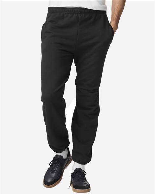 Gildan Unisex Heavy Blend™ Pocket Sweatpants in Black, front view on model